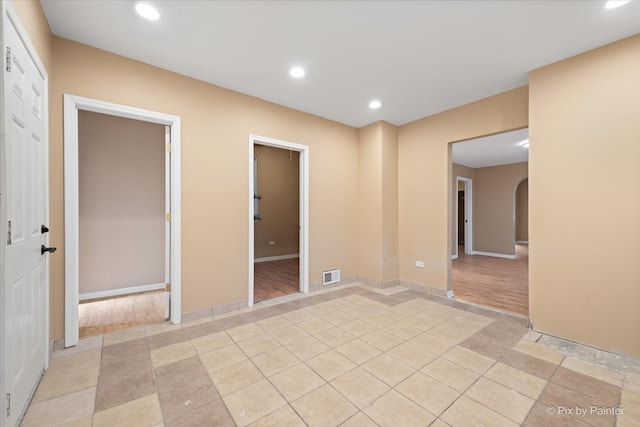 unfurnished room featuring light hardwood / wood-style floors