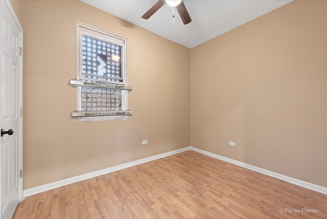 spare room featuring light hardwood / wood-style floors and ceiling fan