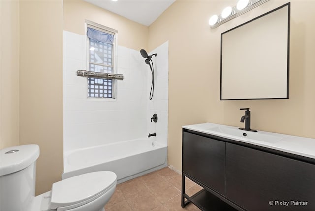 full bathroom featuring vanity, toilet, tile patterned floors, and tiled shower / bath