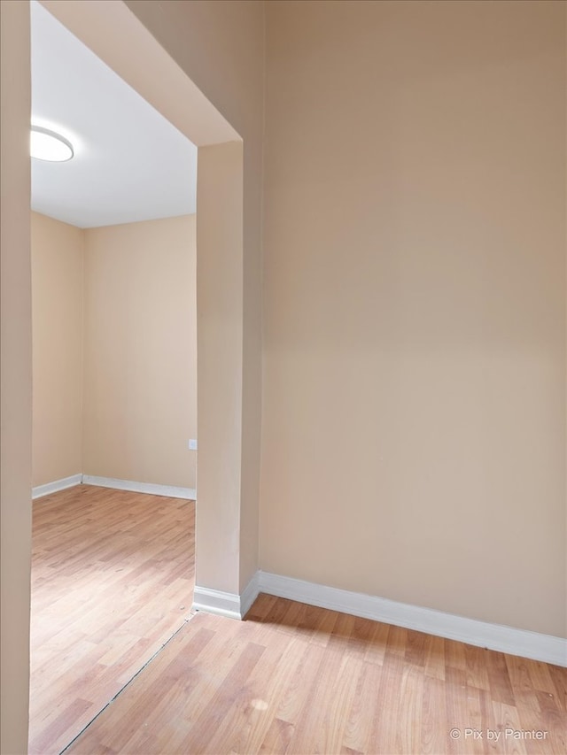 unfurnished room with light hardwood / wood-style flooring