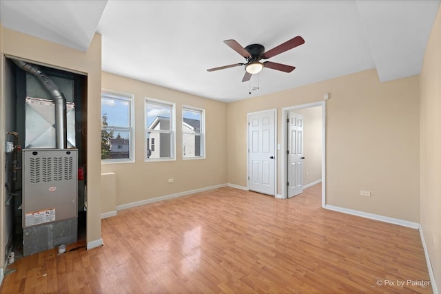 unfurnished bedroom featuring light wood-type flooring and ceiling fan