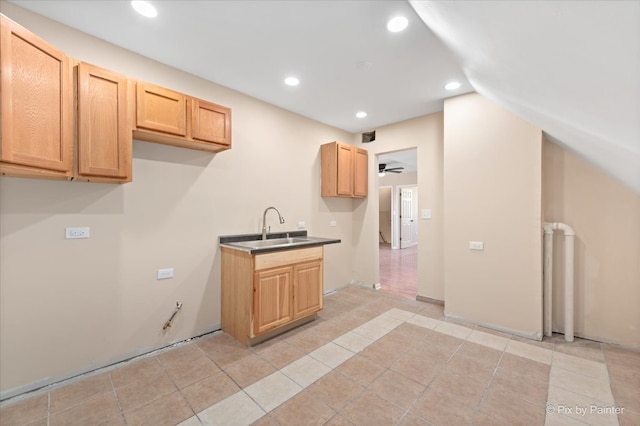 kitchen featuring light tile patterned floors, sink, light brown cabinets, and ceiling fan