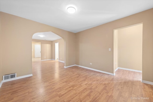 unfurnished room with light wood-type flooring