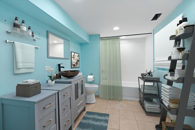 full bathroom with vanity, toilet, shower / tub combo, and tile patterned flooring