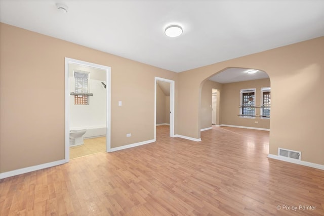 spare room with light hardwood / wood-style floors