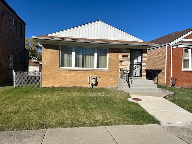 bungalow-style home featuring a front lawn