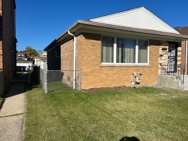 view of side of property featuring a yard