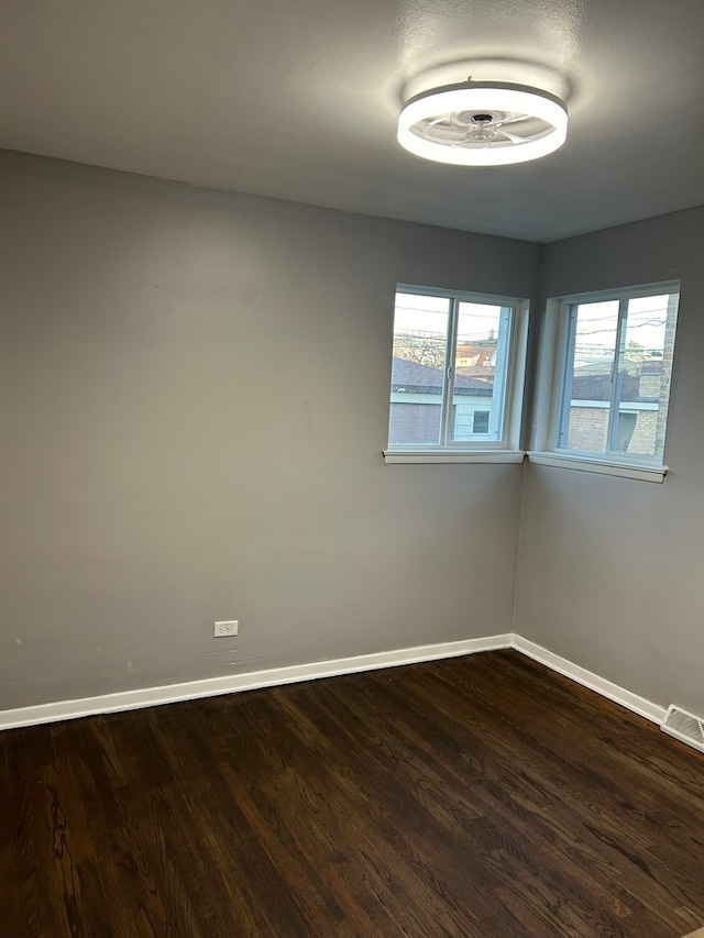 hallway with hardwood / wood-style floors and a textured ceiling