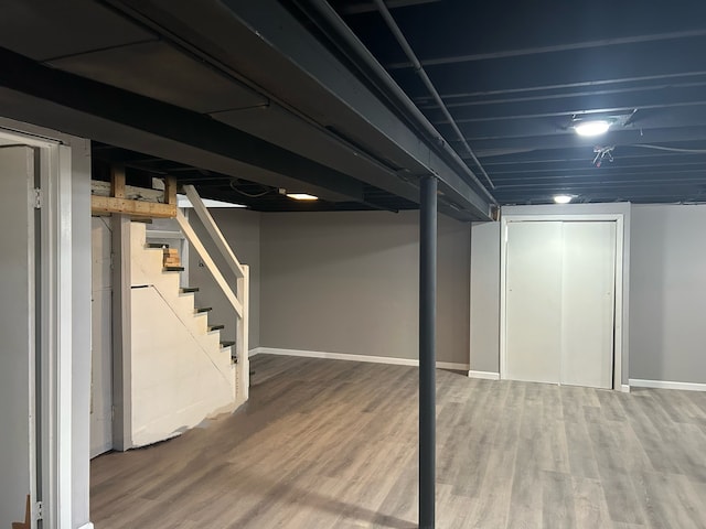 basement featuring hardwood / wood-style floors