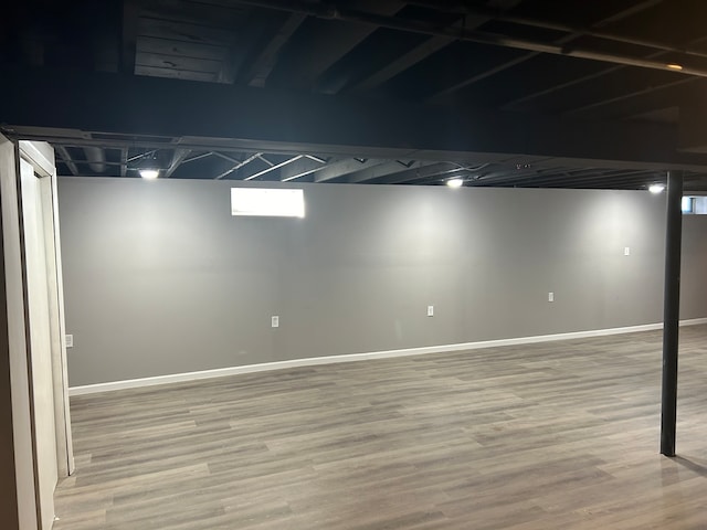 basement with wood-type flooring