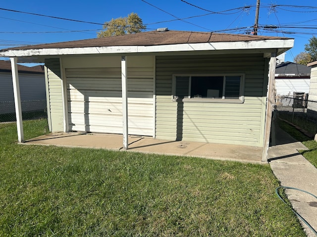 garage featuring a yard