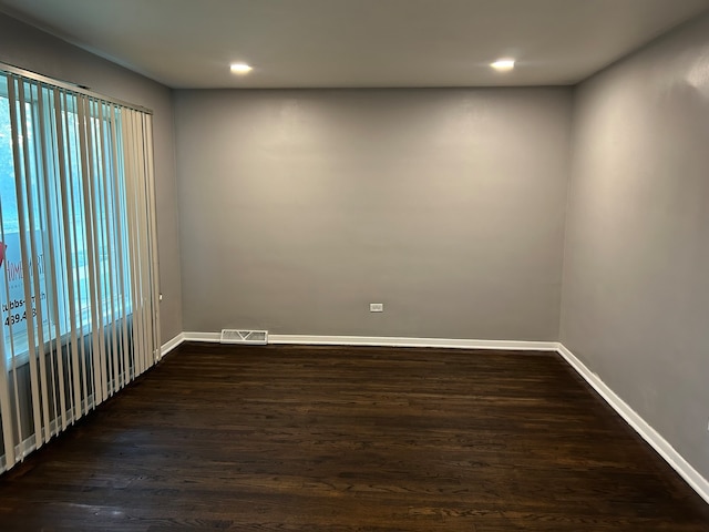 spare room featuring hardwood / wood-style flooring