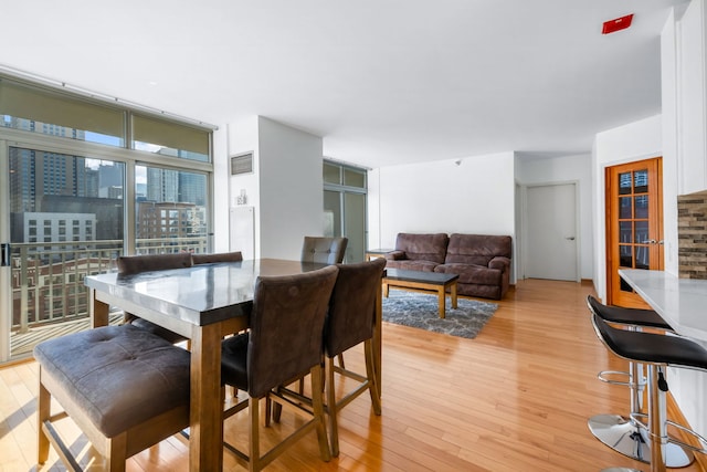 dining space featuring light wood-type flooring