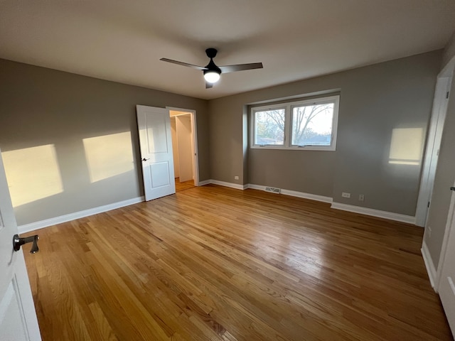 unfurnished bedroom featuring light wood-type flooring and ceiling fan