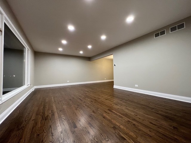 spare room with dark hardwood / wood-style floors