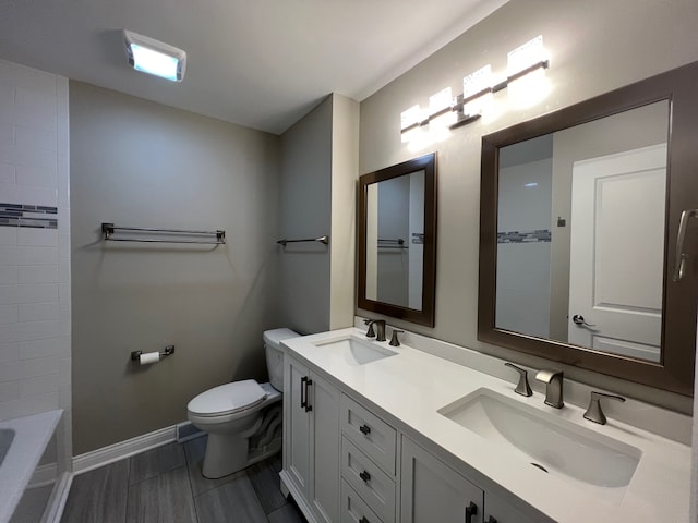 bathroom with vanity, toilet, and tile patterned flooring