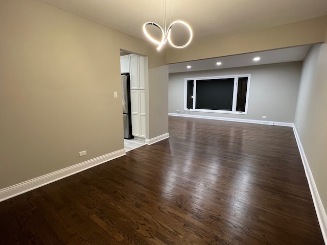 spare room featuring dark wood-type flooring