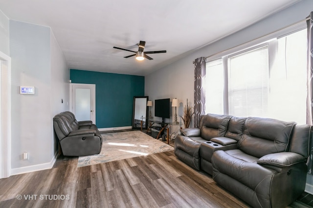 living room featuring ceiling fan and hardwood / wood-style floors