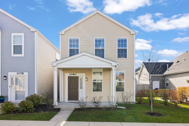 view of property featuring a front yard