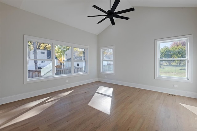 unfurnished room with light hardwood / wood-style floors, a wealth of natural light, and ceiling fan