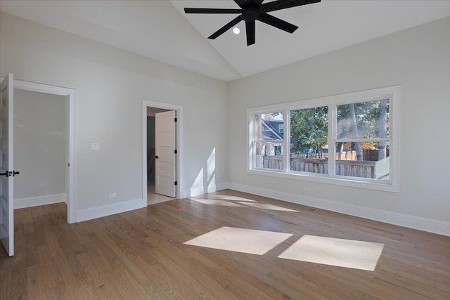 interior space with lofted ceiling, light wood-type flooring, and ceiling fan