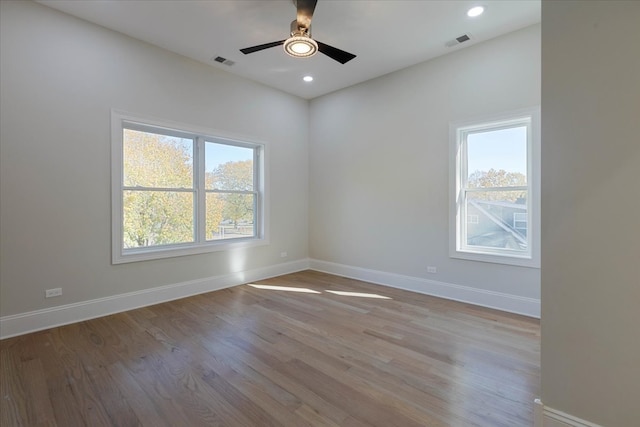 unfurnished room with ceiling fan and light wood-type flooring