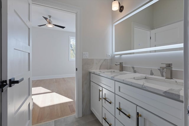 bathroom featuring vanity, ceiling fan, and hardwood / wood-style flooring