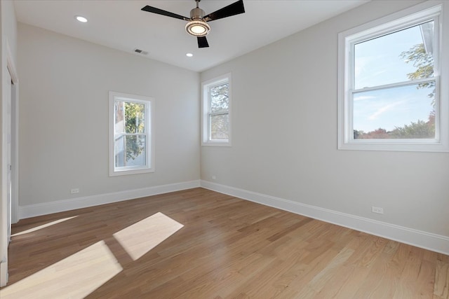 empty room with light wood-type flooring and ceiling fan