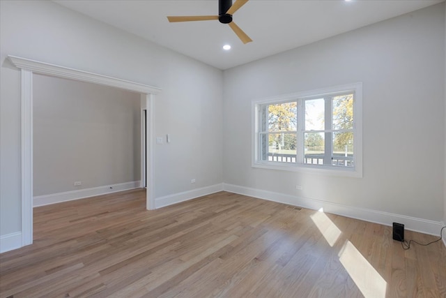 unfurnished room featuring ceiling fan and light hardwood / wood-style flooring