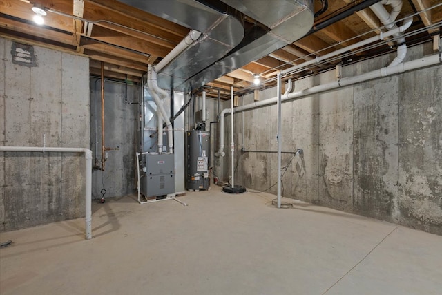 basement featuring heating unit and gas water heater