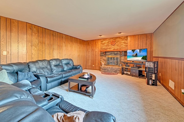 living room featuring a fireplace, carpet floors, and wood walls