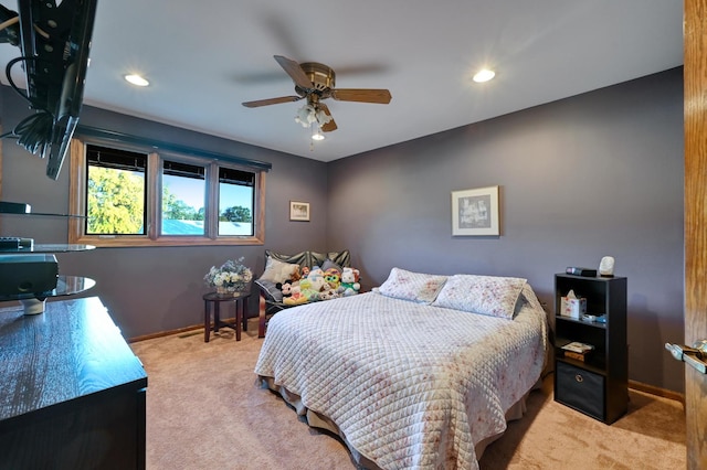 bedroom featuring light carpet and ceiling fan