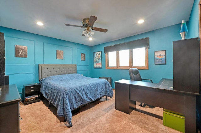 bedroom featuring light carpet and ceiling fan