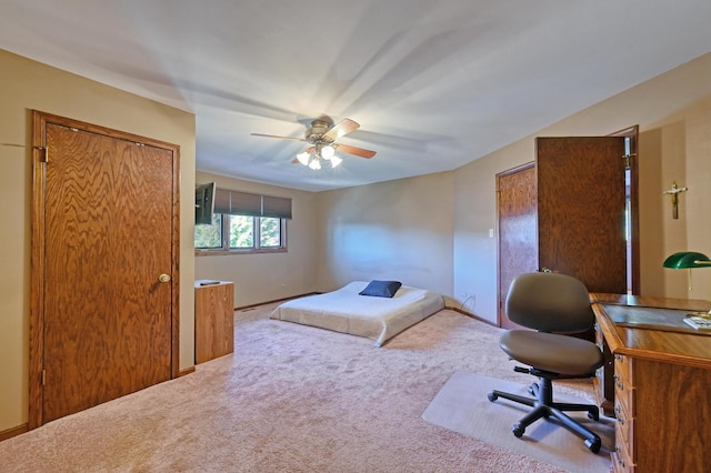 bedroom featuring ceiling fan and carpet floors