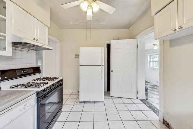 kitchen with white appliances, ceiling fan, tasteful backsplash, and white cabinetry