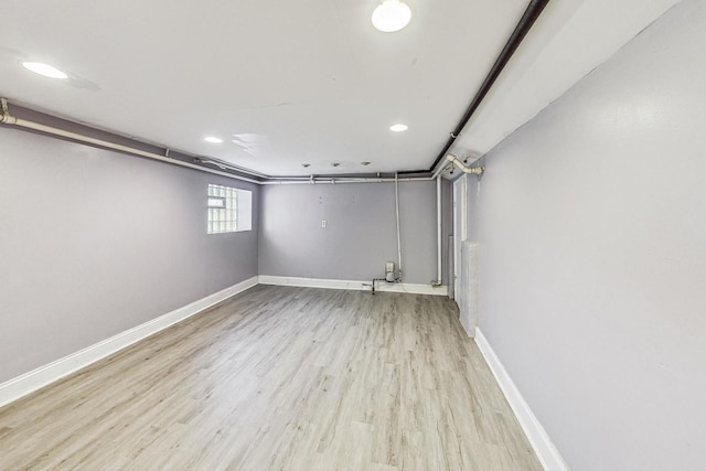 basement featuring light hardwood / wood-style floors