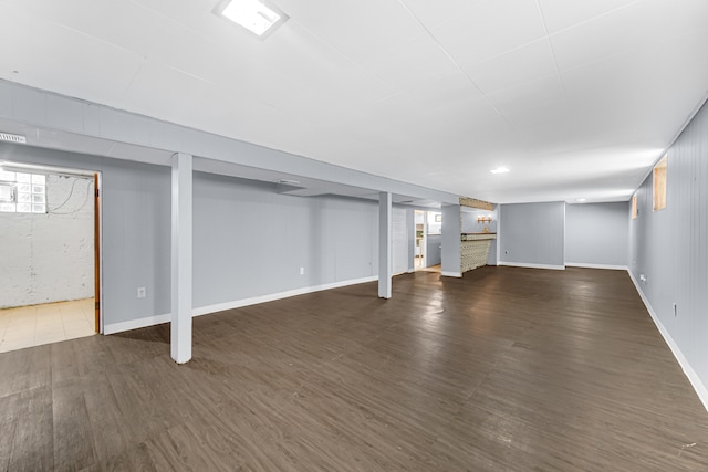 basement with dark wood-type flooring