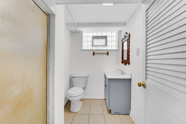 bathroom with vanity, toilet, and tile patterned floors