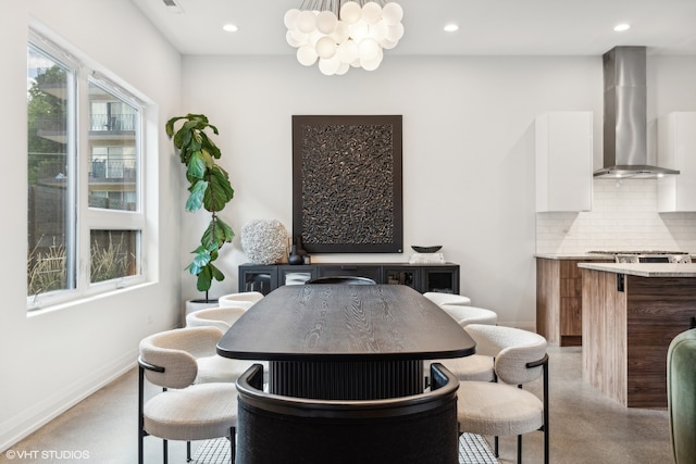 dining area featuring a notable chandelier