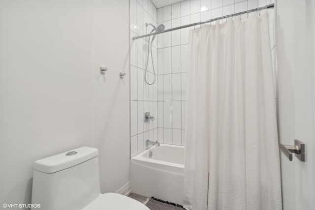 bathroom featuring toilet and shower / tub combo with curtain