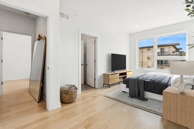 bedroom with light hardwood / wood-style flooring