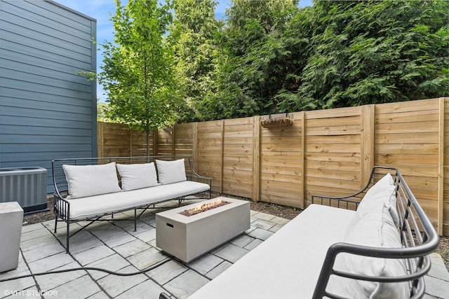 view of patio / terrace with central air condition unit and an outdoor living space