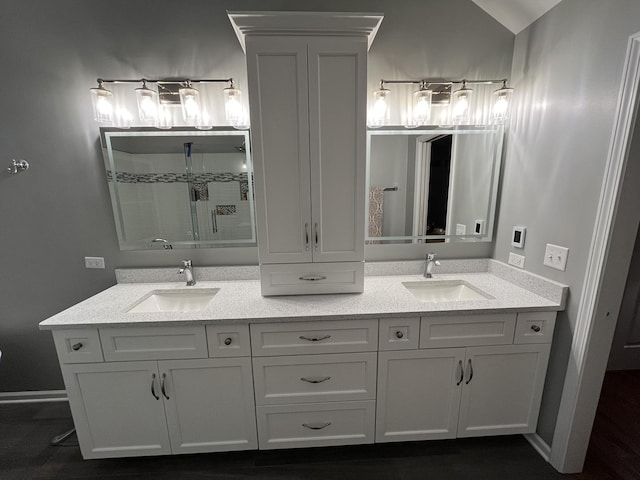 bathroom featuring vanity and an enclosed shower