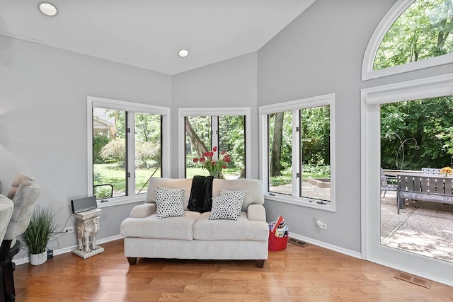 sunroom / solarium with vaulted ceiling and visible vents