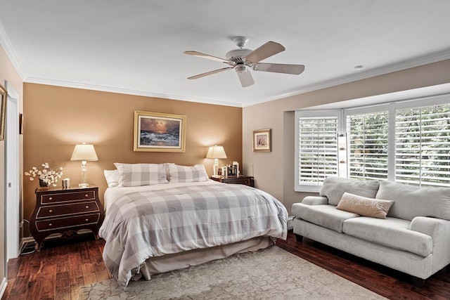 bedroom with ornamental molding, dark wood finished floors, and a ceiling fan