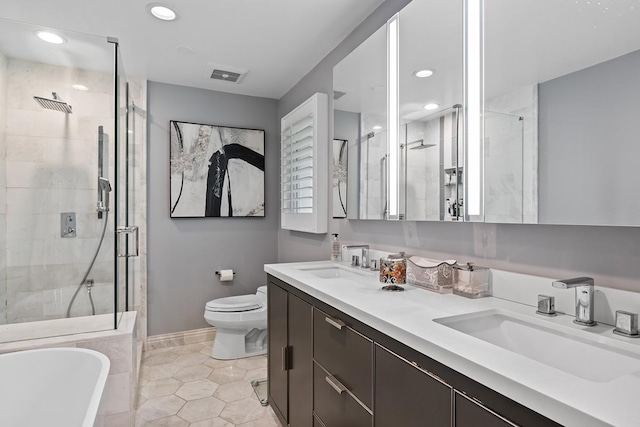 bathroom with a soaking tub, visible vents, a sink, and a shower stall