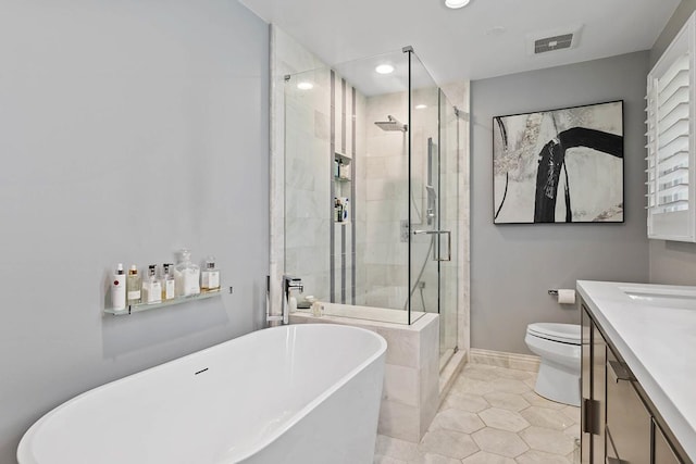 full bathroom featuring a soaking tub, visible vents, vanity, a shower stall, and tile patterned flooring