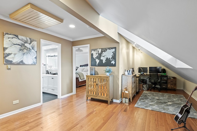 bonus room with lofted ceiling with skylight, baseboards, wood finished floors, and recessed lighting