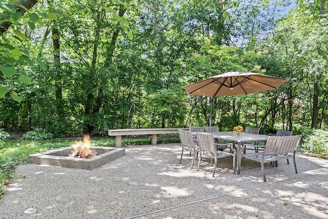 view of patio / terrace featuring outdoor dining space and a fire pit