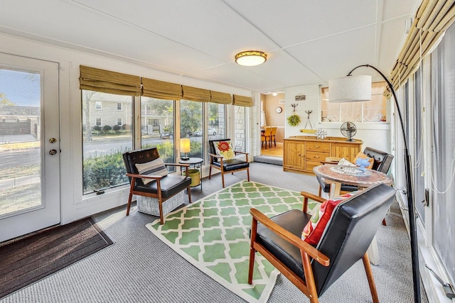 sunroom / solarium with french doors and a healthy amount of sunlight